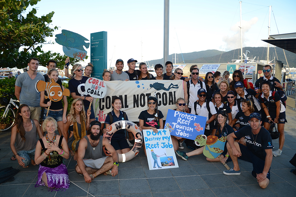 Australian Marine Conservation Society supporters gather at a protest in Cairns to protect the Great Barrier Reef.